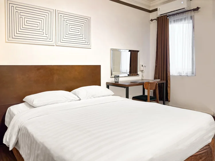 Norfolk: Sprei putih di setiap kasur, standar yang sama di semua unit kami.